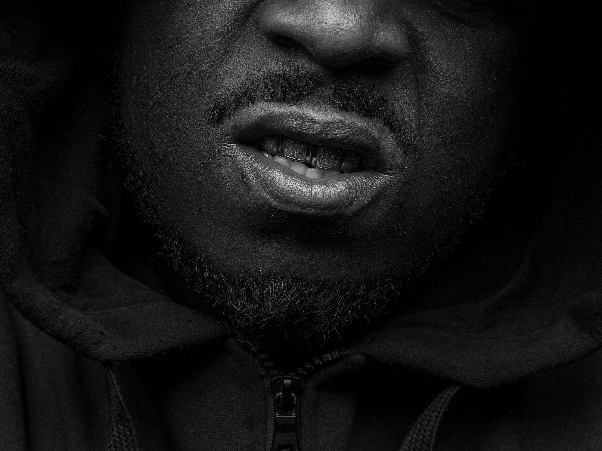 Spank D, member of ABN crew, shows off his grill in Houston, Texas, photographed by Houston photographer, Todd Spoth.