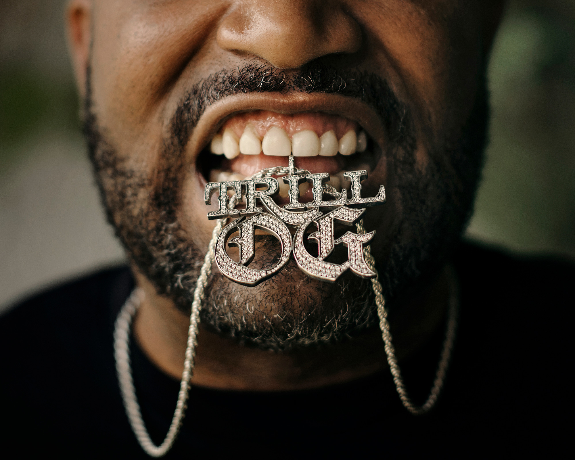 Bun B, hip hop artist, professor, and one half of legendary rap duo, UGK, and his "Trill OG" piece and chain, photographed on location in Houston, Texas by Houston music photographer, Todd Spoth.