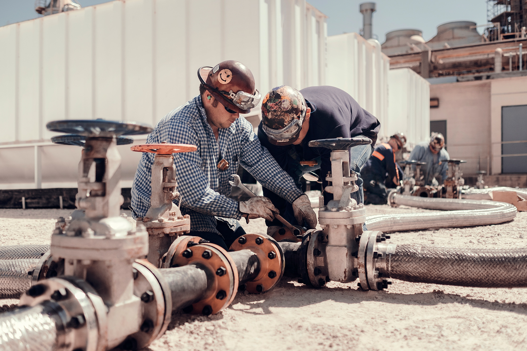 Exxon Mobil refinery operations team at work in an oil refinery, photographed by corporate photographer, Todd Spoth.
