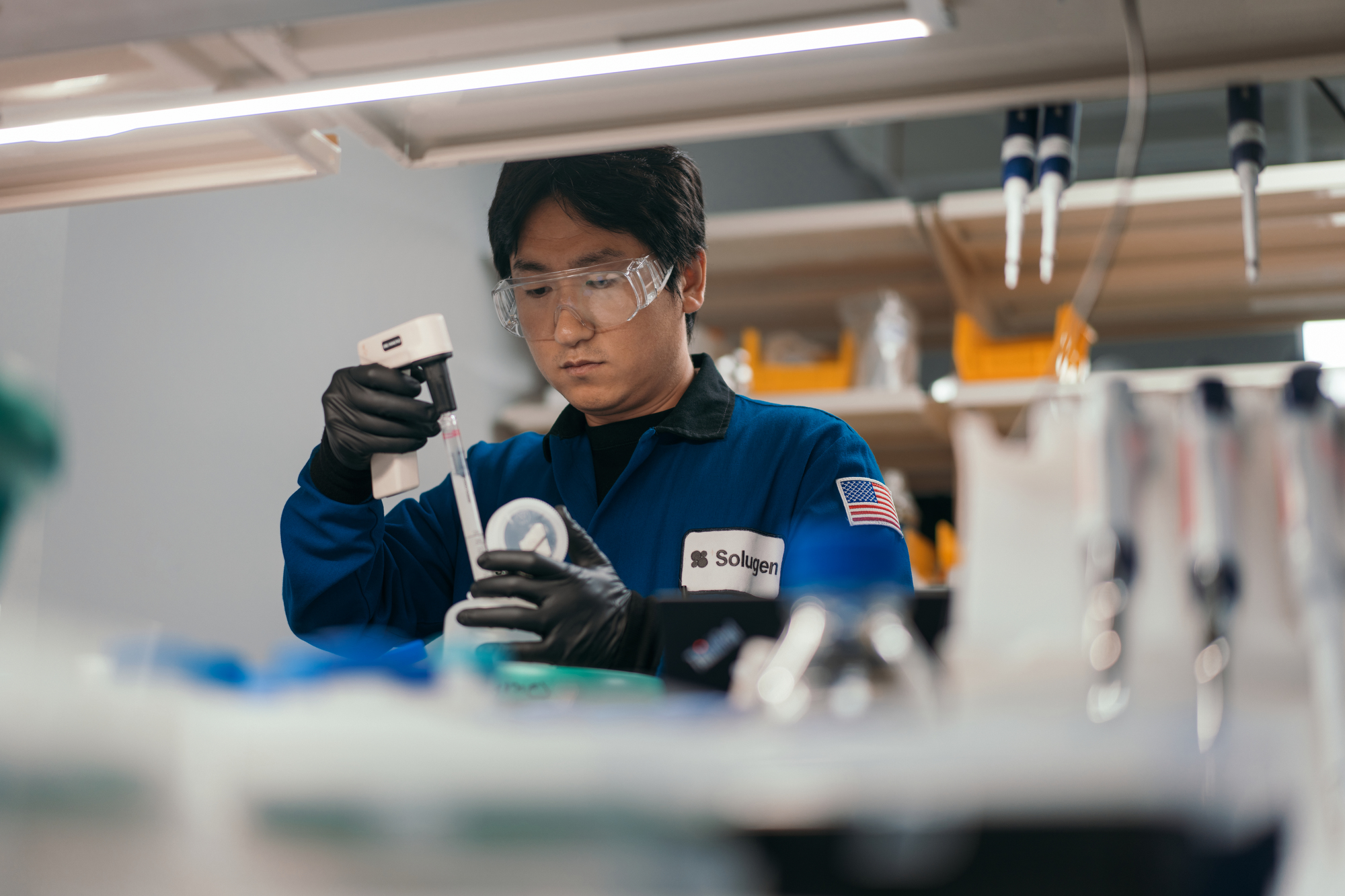 A chemical lab worker at Solugen laboratories, photographed by corporate photographer, Todd Spoth.