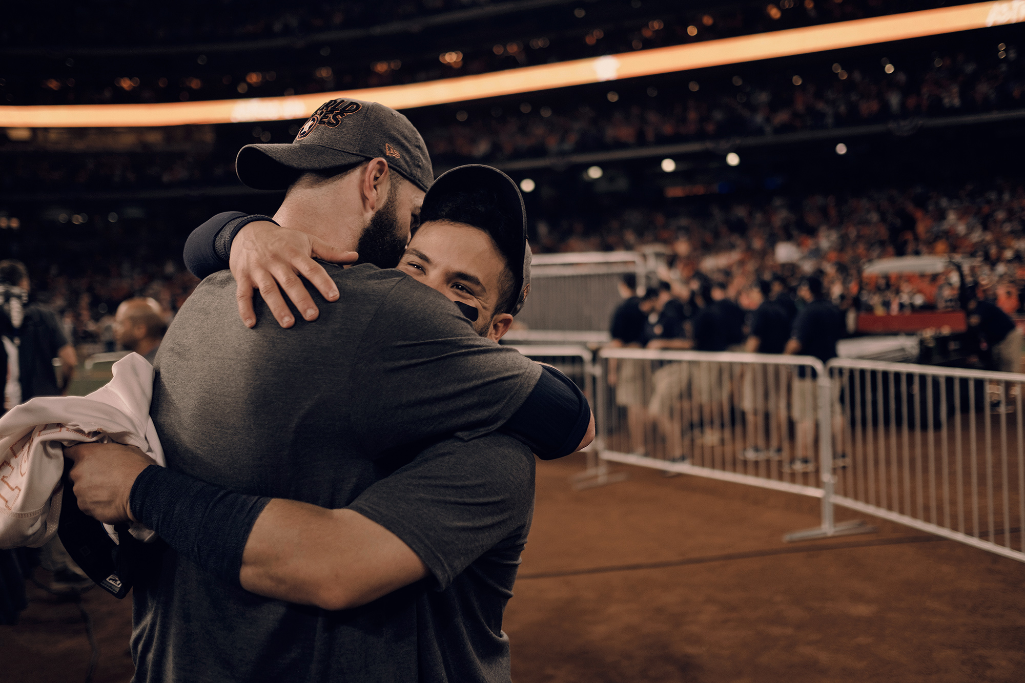 Jose Altuve, Houston Astros player, embraces teammate, Dallas Keuchel, during the 2017 ALCS at Minute Maid Park in Houston, Texas photographed by Todd Spoth.