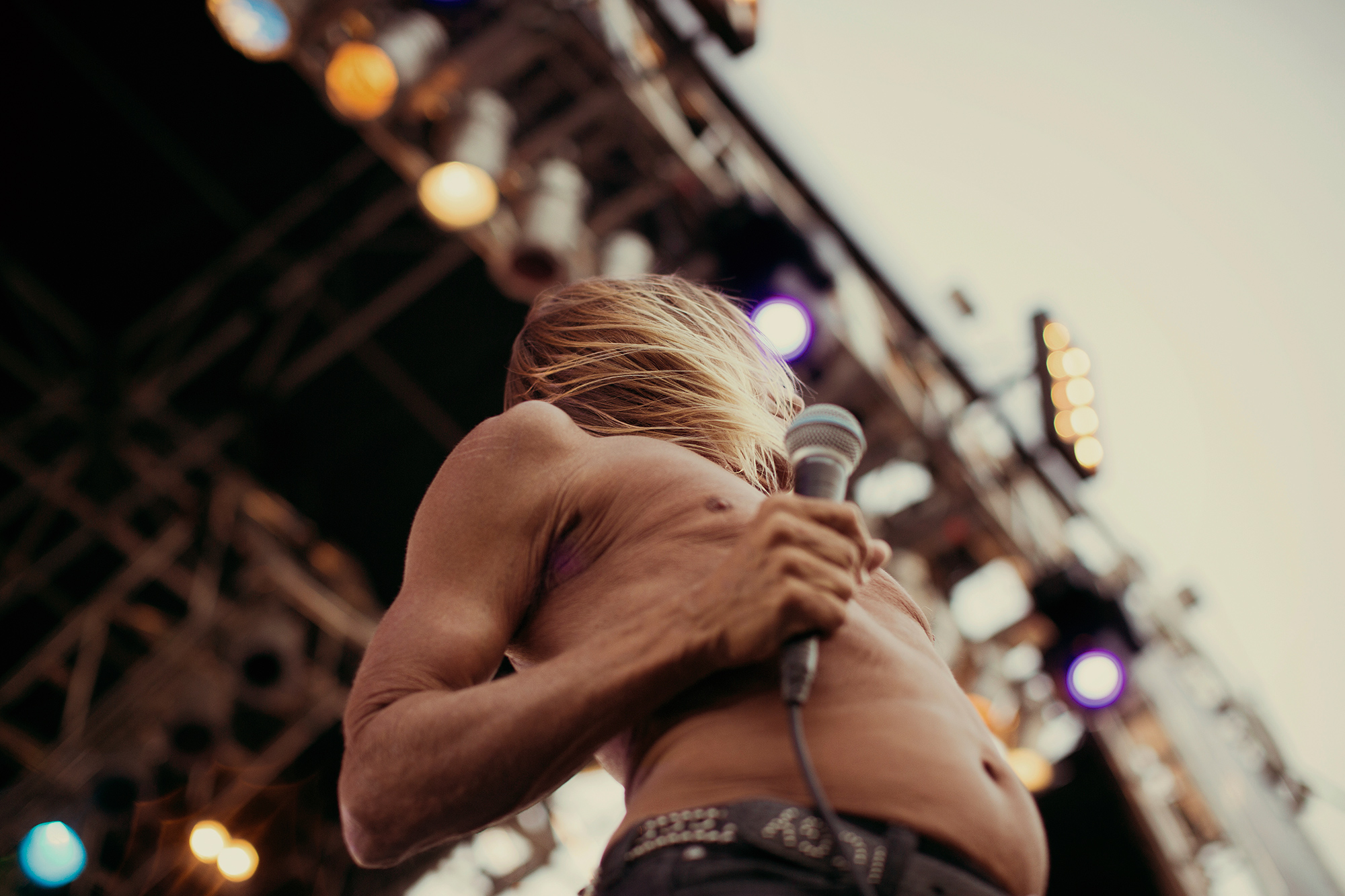 Iggy Pop, frontman of The Stooges, performs at Free Press Summer Fest music festival in Houston, Texas, photographed by Todd Spoth.