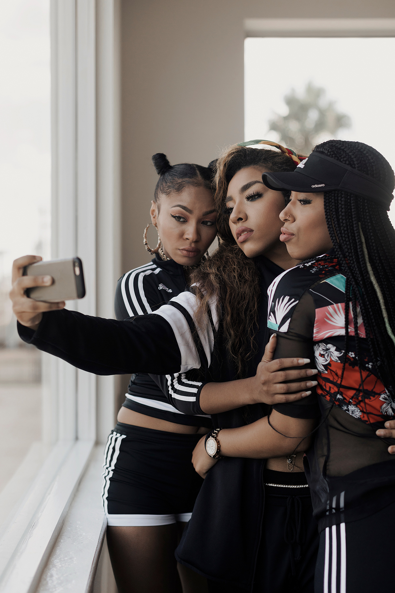 Blushhh Music, Music World Entertainment r&b and hip hop group, takes a selfie at the Music World Entertainment offices in midtown Houston, Texas, photographed by music photographer, Todd Spoth.